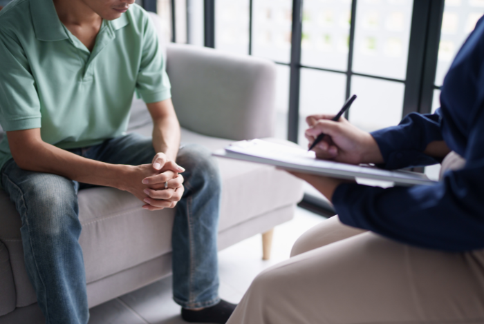 Dr. Lynn Winsten taking notes during an anxiety therapy session in her Berkeley office.